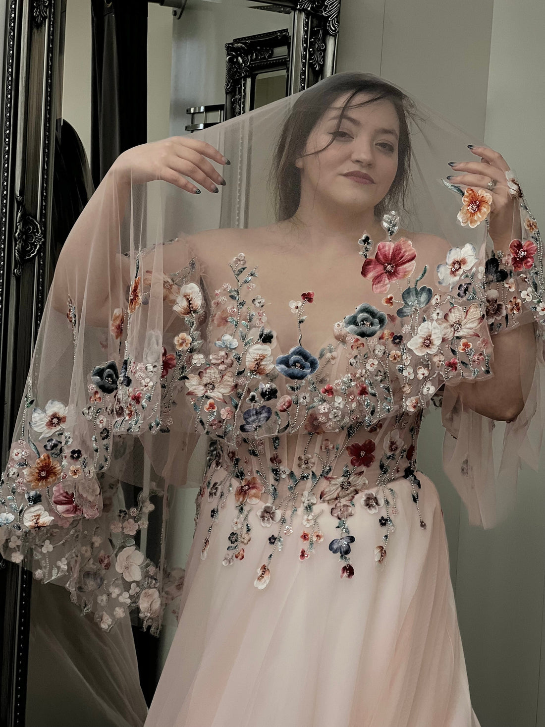 Blush tulle floral ball gown wedding dress with off-shoulder corset bodice and colorful 3D flower embroidery and matching veil