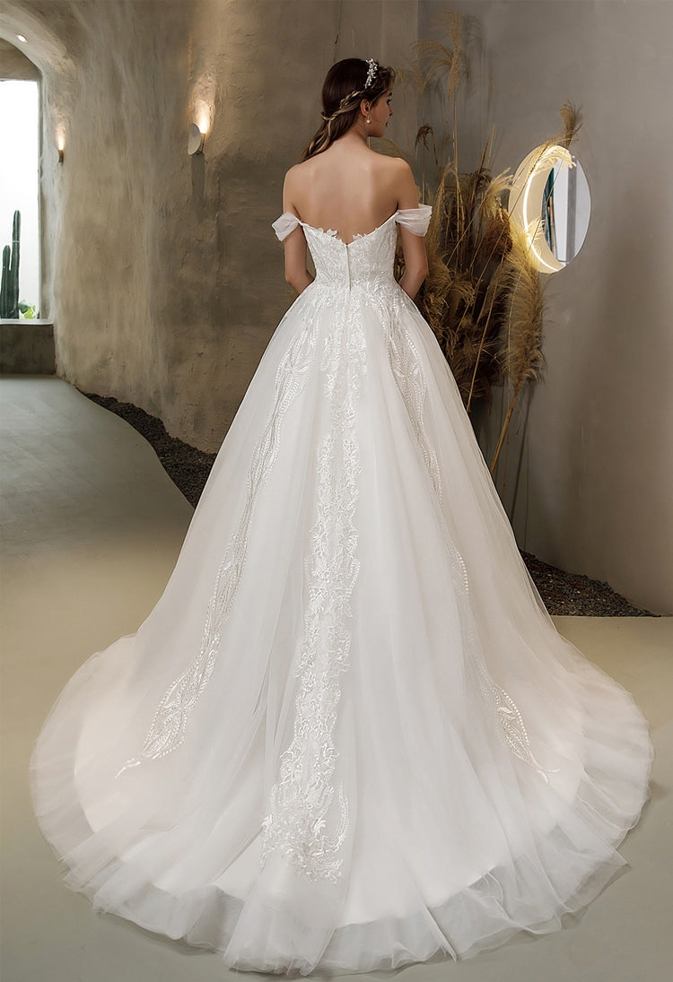 Back view: off-shoulder lace wedding gown with low back and flowing tulle ballgown skirt