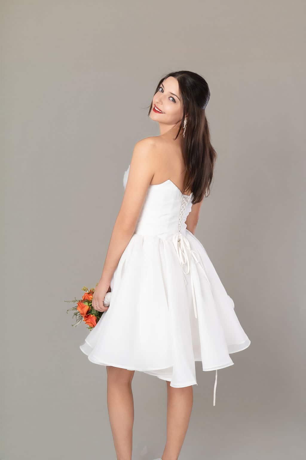 Back view of Ethereal Romance dress with lace-up corset bodice and flowing skirt