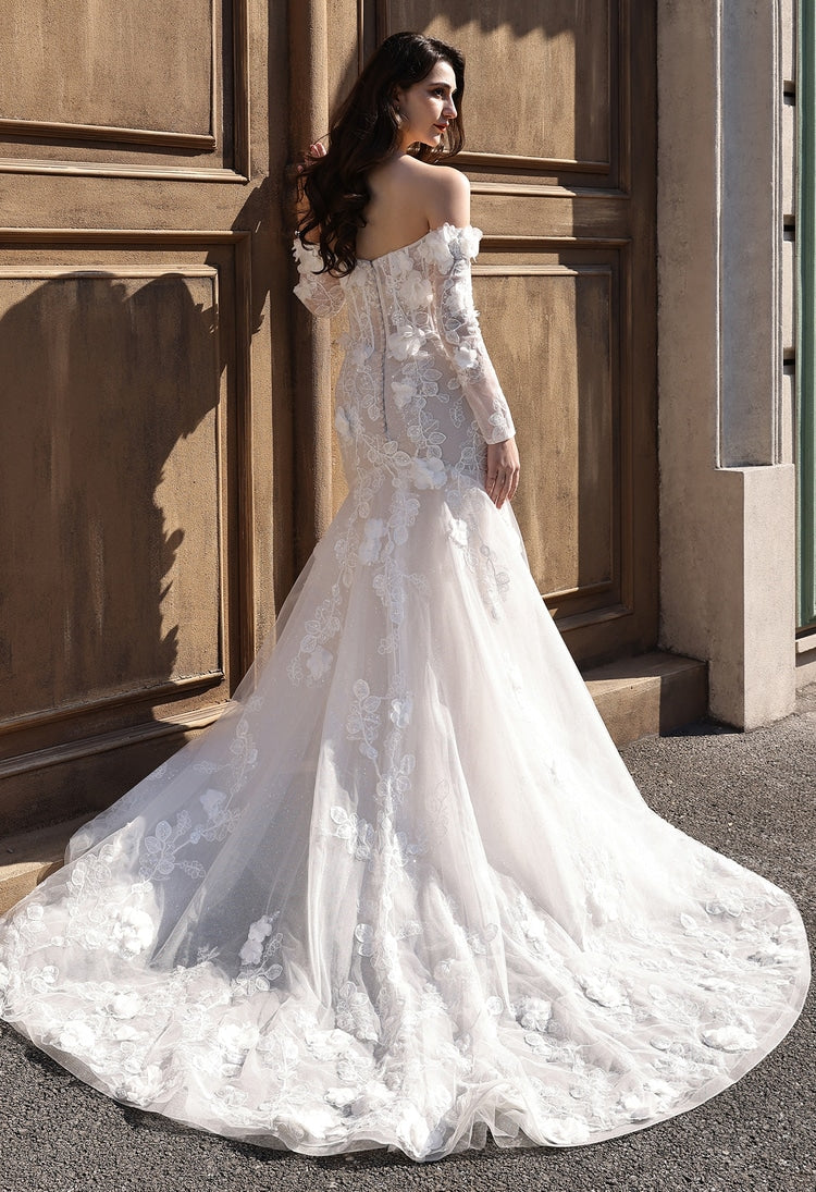 Back view of off-the-shoulder fit-and-flare wedding dress with cascading lace and chapel train
