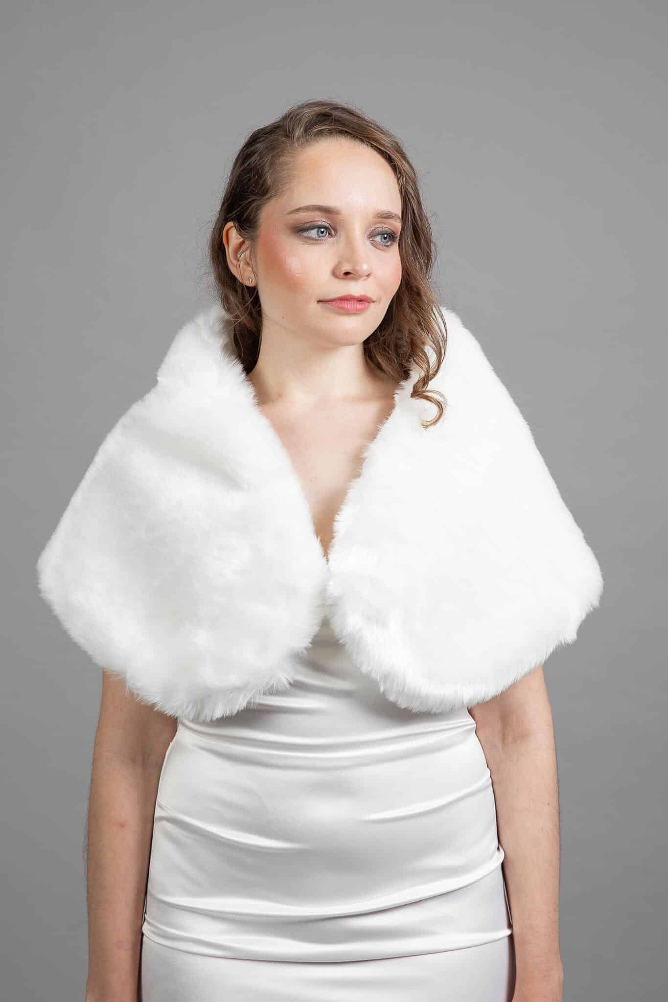 White faux fur wrap draped over shoulders – Art Kollocsion Auckland