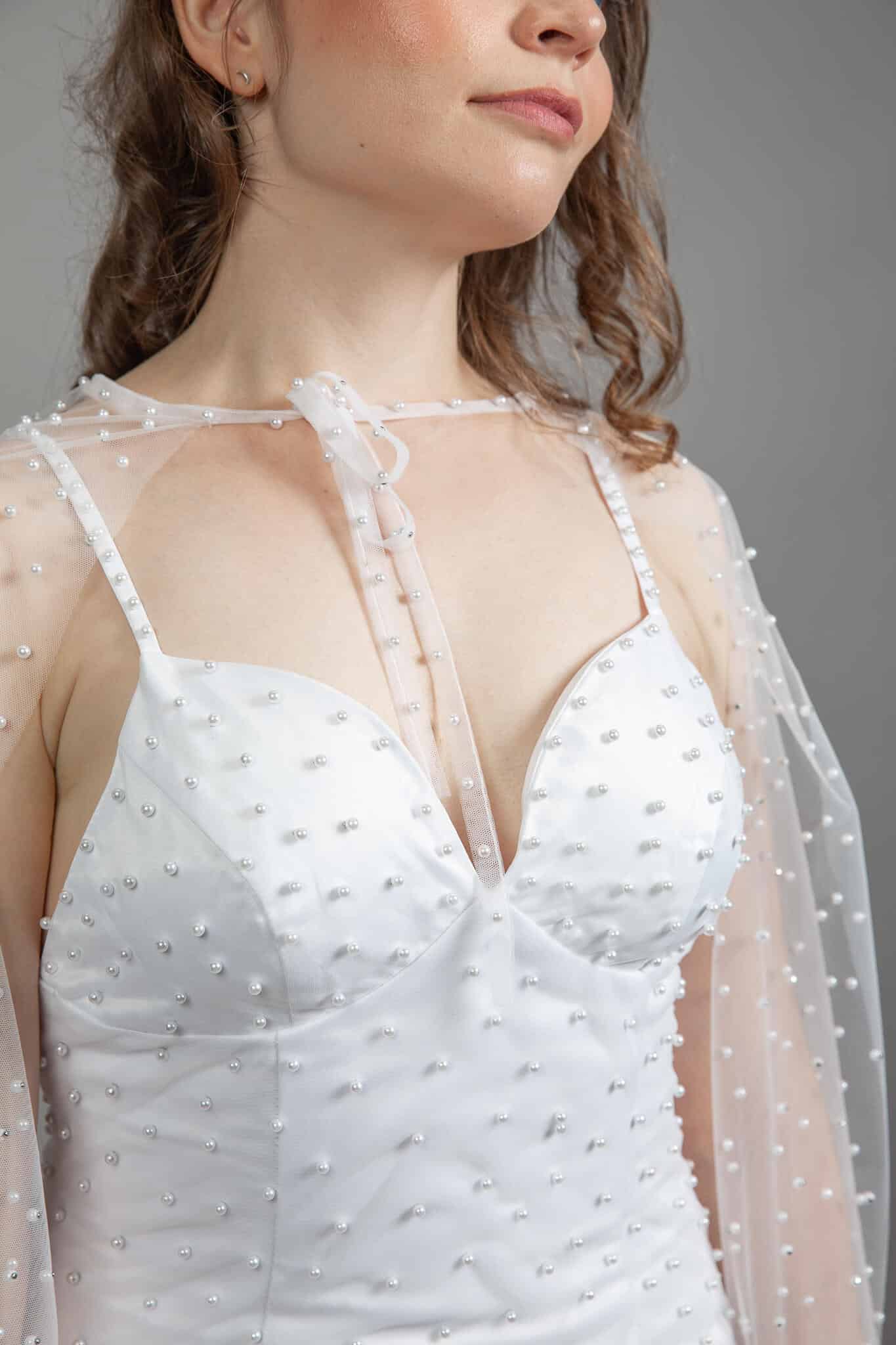 Close-up of pearl-studded satin sweetheart bodice on the Beautiful Pearl Wedding Dress – Art Kollocsion Auckland