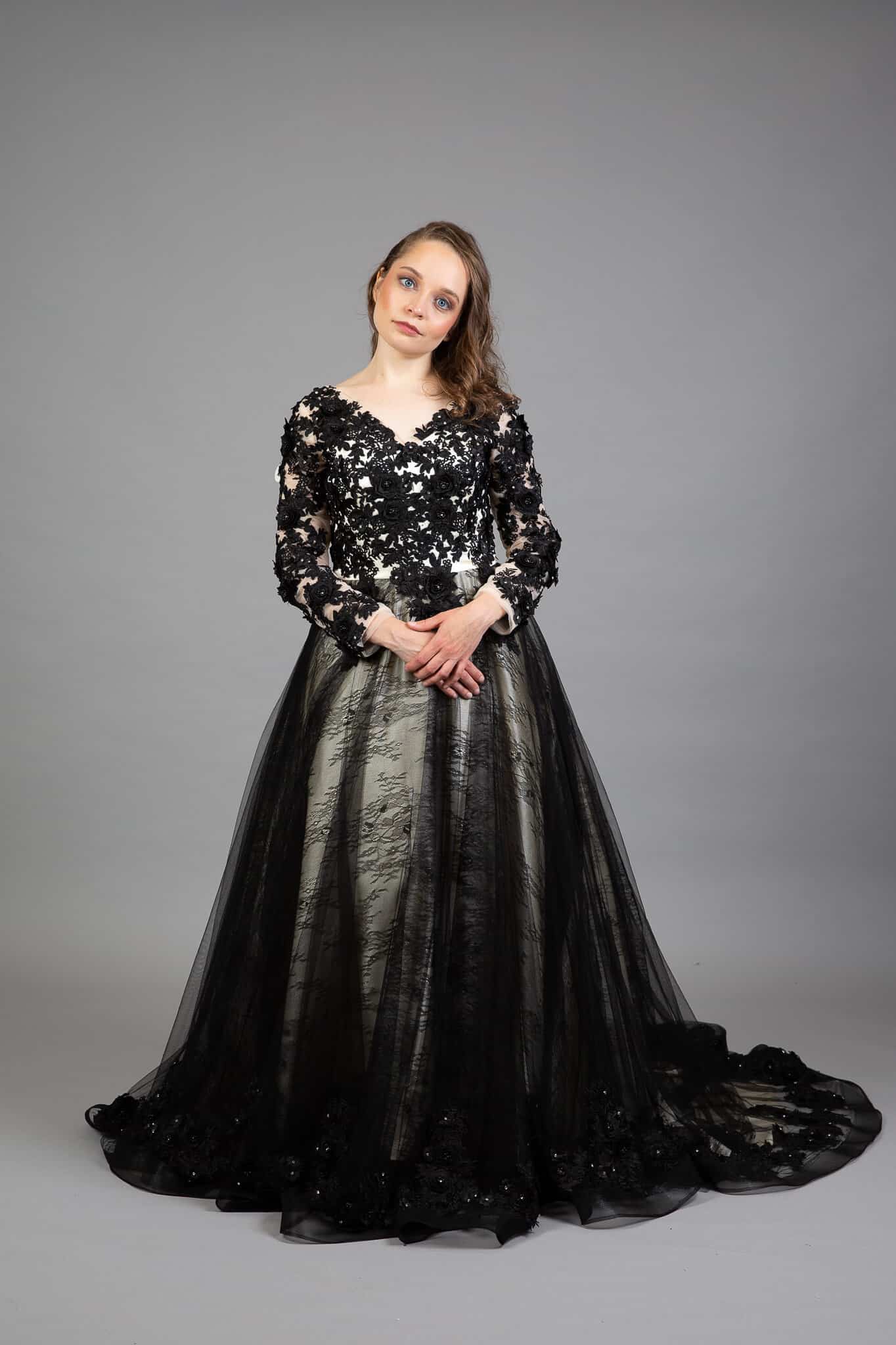 Front view of Gothic wedding dress with V-neckline, beaded bodice, and black tulle ball gown skirt