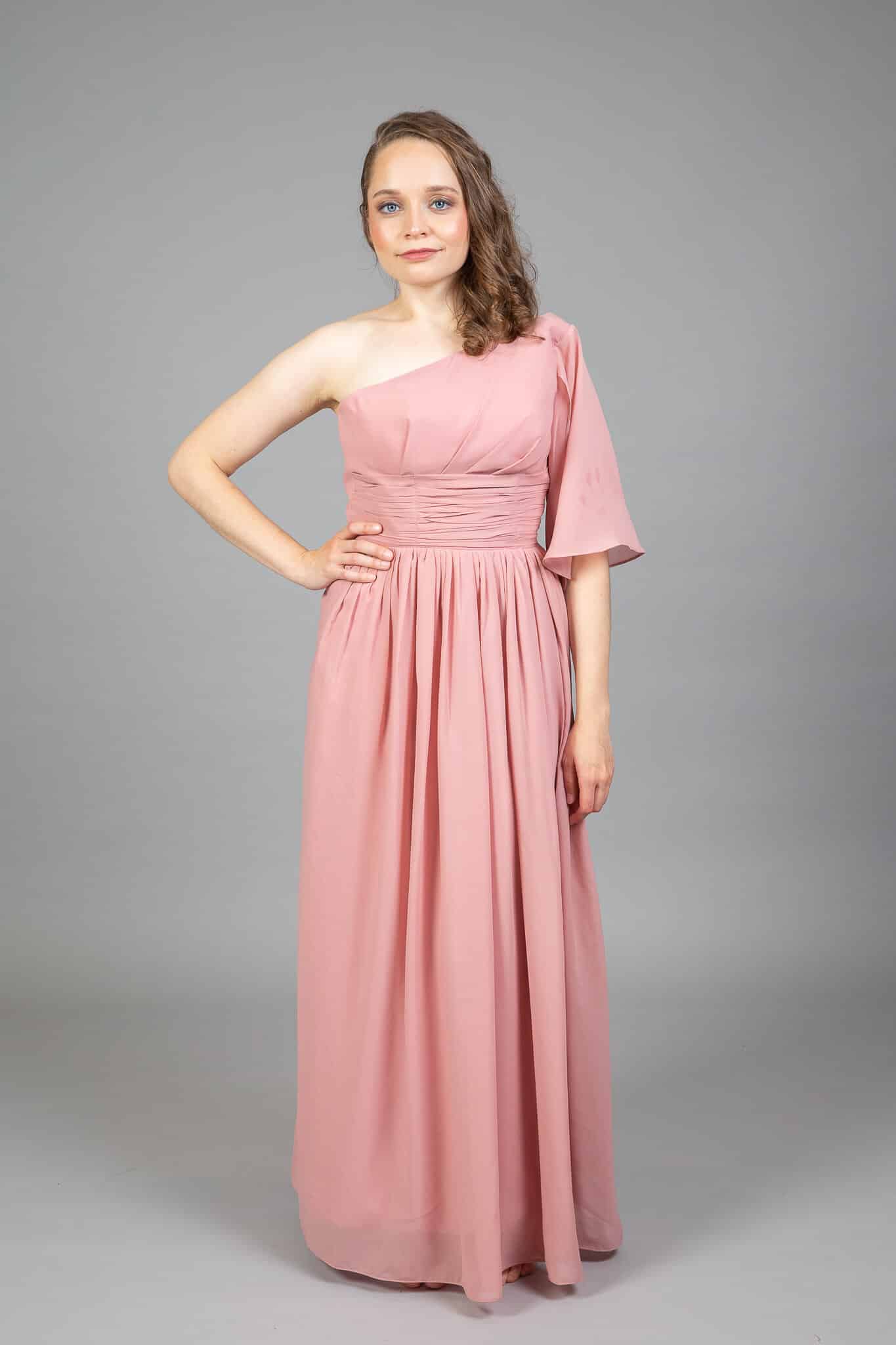 Dusty pink one-shoulder chiffon bridesmaids dress with flutter sleeve and ruched waistband, model front view
