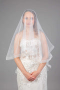 Bride in white horsehair edge veil with cascading tulle, front view – Art Kollocsion Auckland