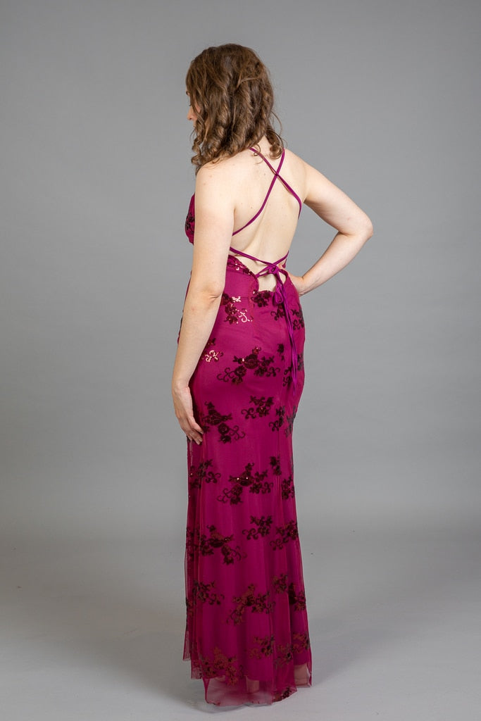 Back view of floral embroidered dress showing criss-cross spaghetti strap detail
