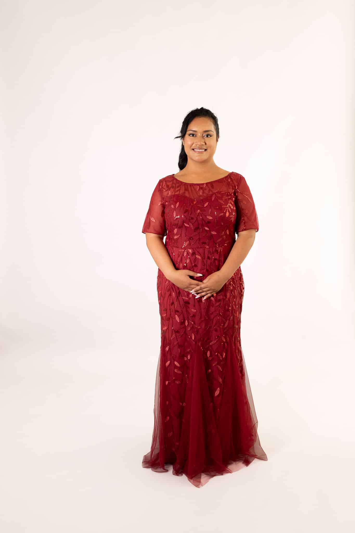 Deep red tulle dress with short sleeves and beaded leaf motif, floor-length mermaid silhouette