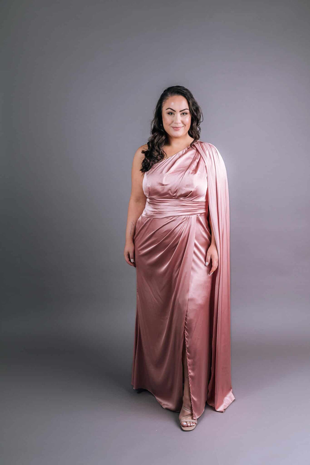 Rose pink satin gown with one-shoulder Greek-style neckline, diagonal ruching bodice and draped shawl – Art Kollocsion Auckland
