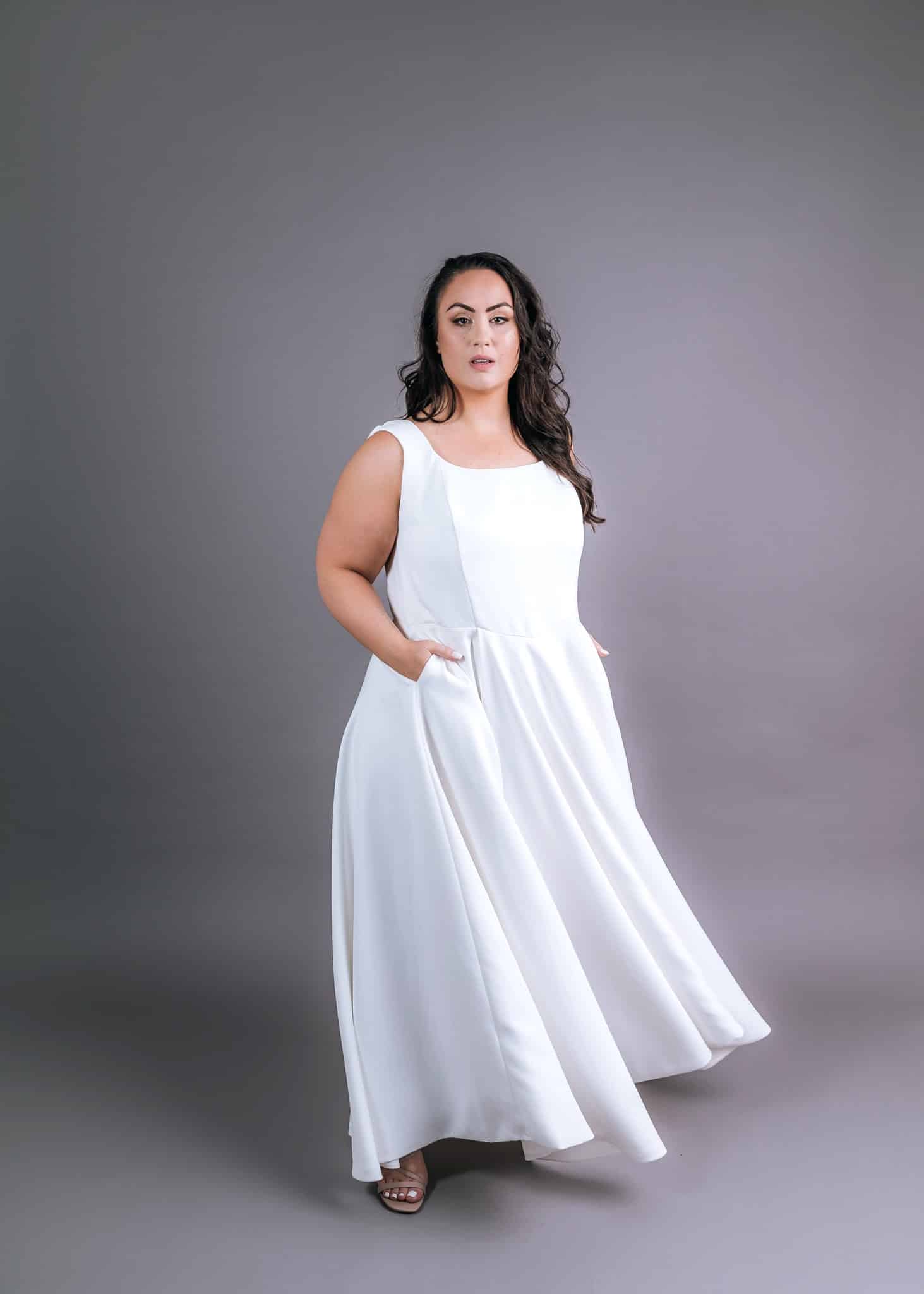 White plus-size wedding gown with scoop neckline and sleeveless A-line skirt – Art Kollocsion Auckland