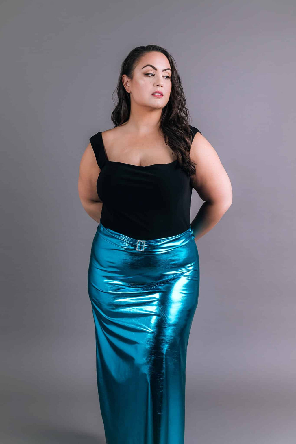 Front view of electric blue metallic skirt with ruched detail and square neckline black top