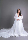 Plunge neckline wedding gown with sheer lace sleeves and full A-line skirt, front view – Art Kollocsion Auckland