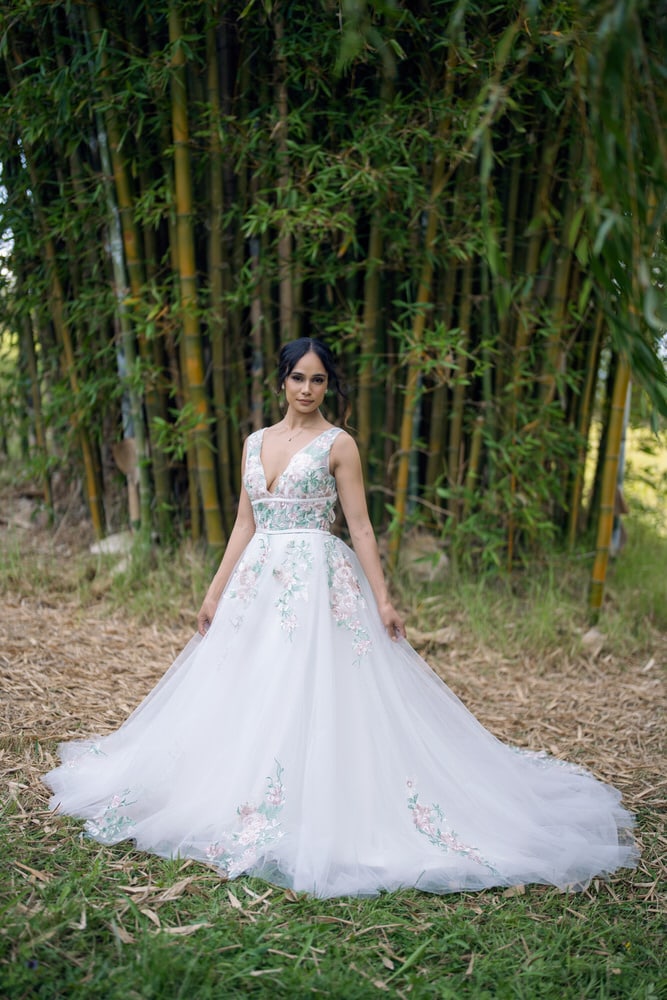 Front view of Green Forest Wedding Gown with blush floral embroidery and sage trim – Art Kollocsion Auckland