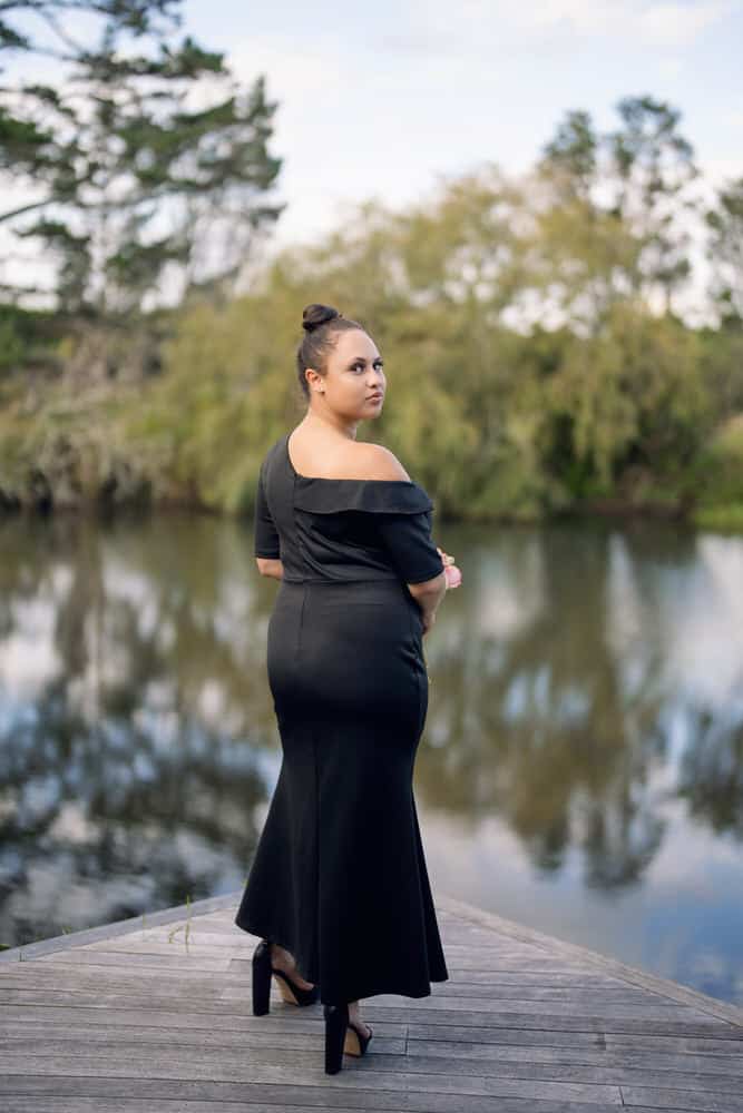 Black one off the shoulder bridesmaids dress with ruffle neckline and fishtail hem, back view – Art Kollocsion Auckland