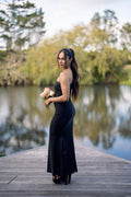 Black one shoulder bridesmaids dress, fitted maxi with leg slit, side view on model – Art Kollocsion Auckland