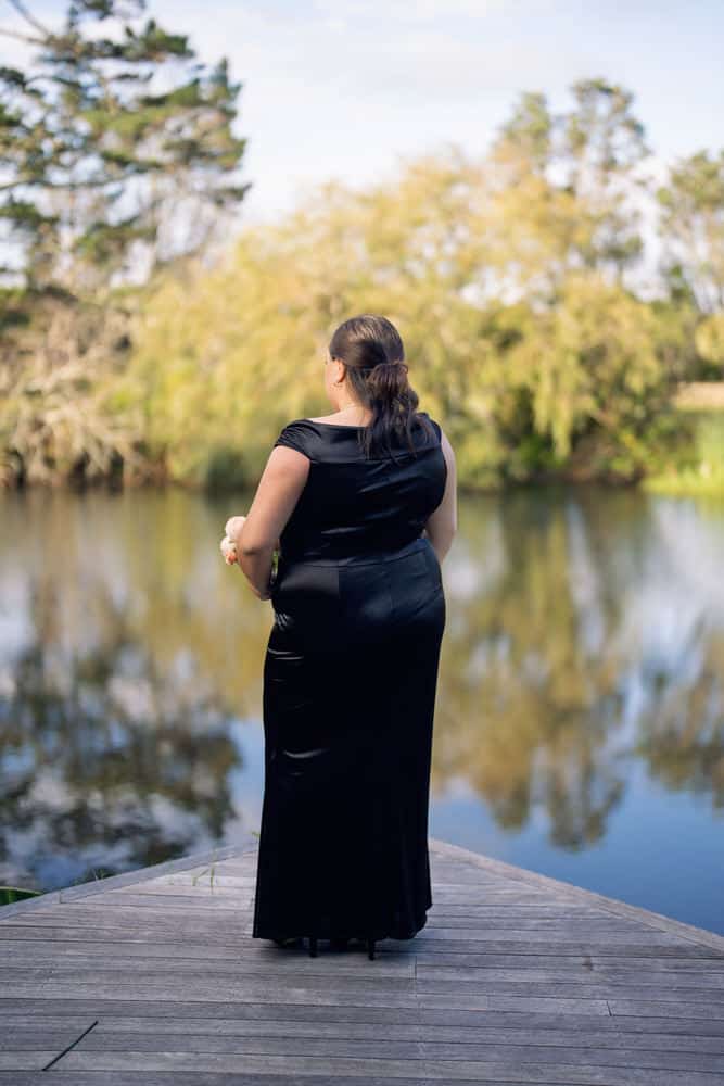 Black plus size bridesmaid dress with draped cowl neckline, back view – Art Kollocsion Auckland