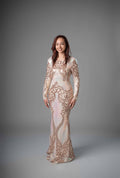 Model wearing long sleeve rose gold sequin embroidered mermaid gown in cream – Art Kollocsion Auckland