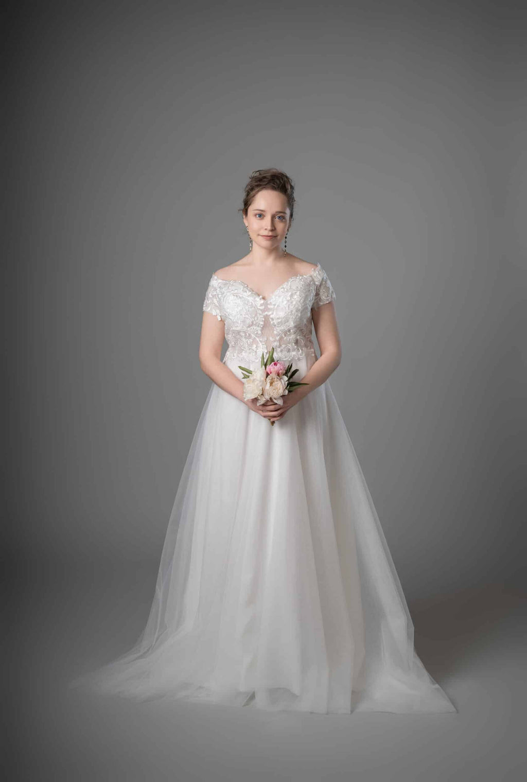 Bride in off-shoulder white lace princess gown with tulle skirt and train – Art Kollocsion Auckland