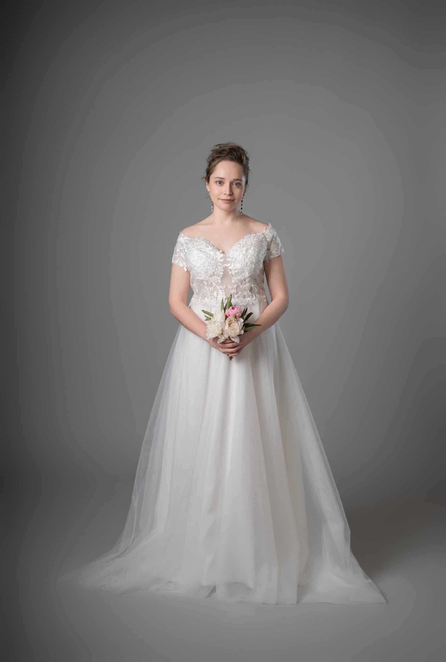 Bride in off-shoulder white lace princess gown with tulle skirt and train – Art Kollocsion Auckland