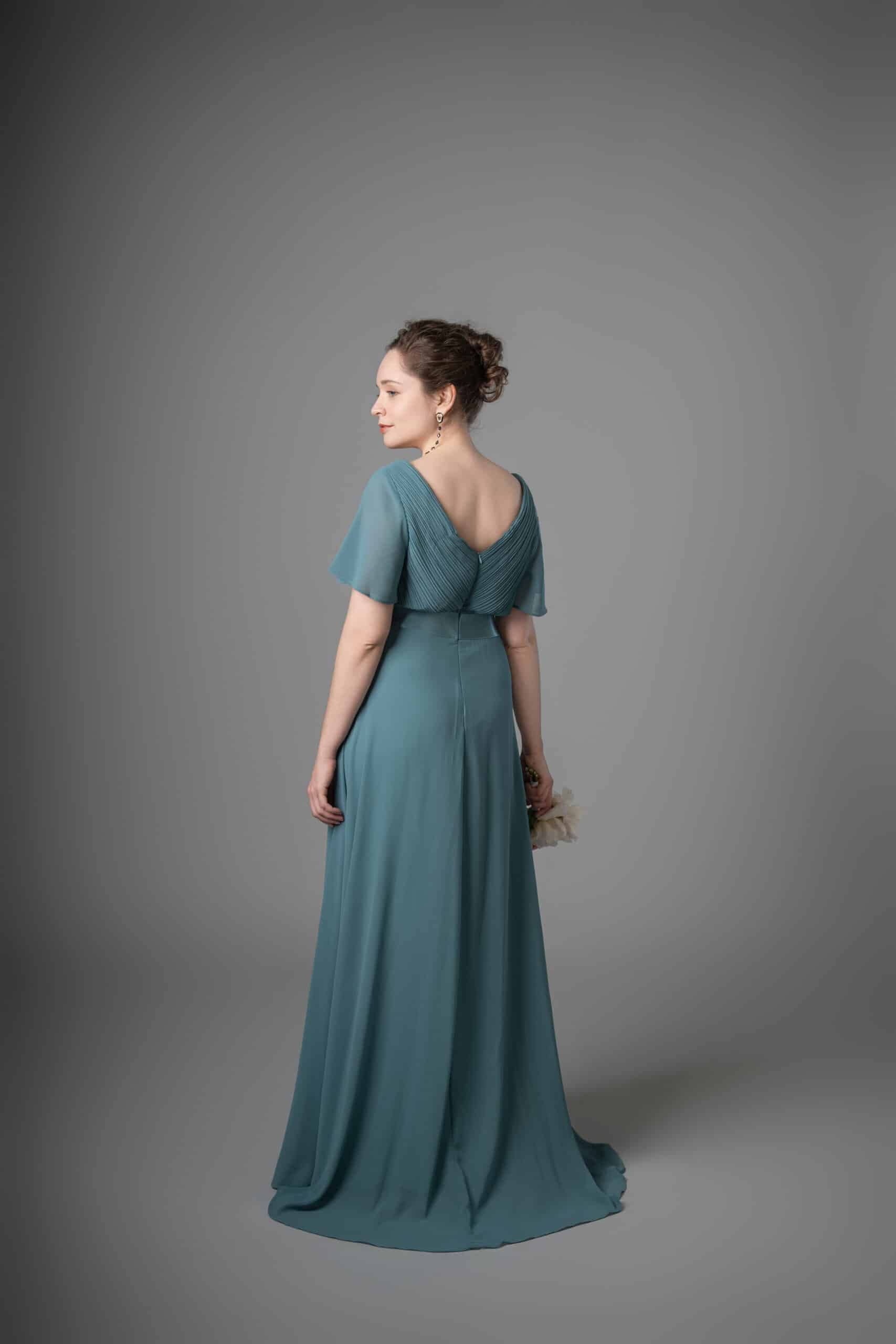 Teal chiffon bridesmaids dress back view showing V-neckline and cascading drapes