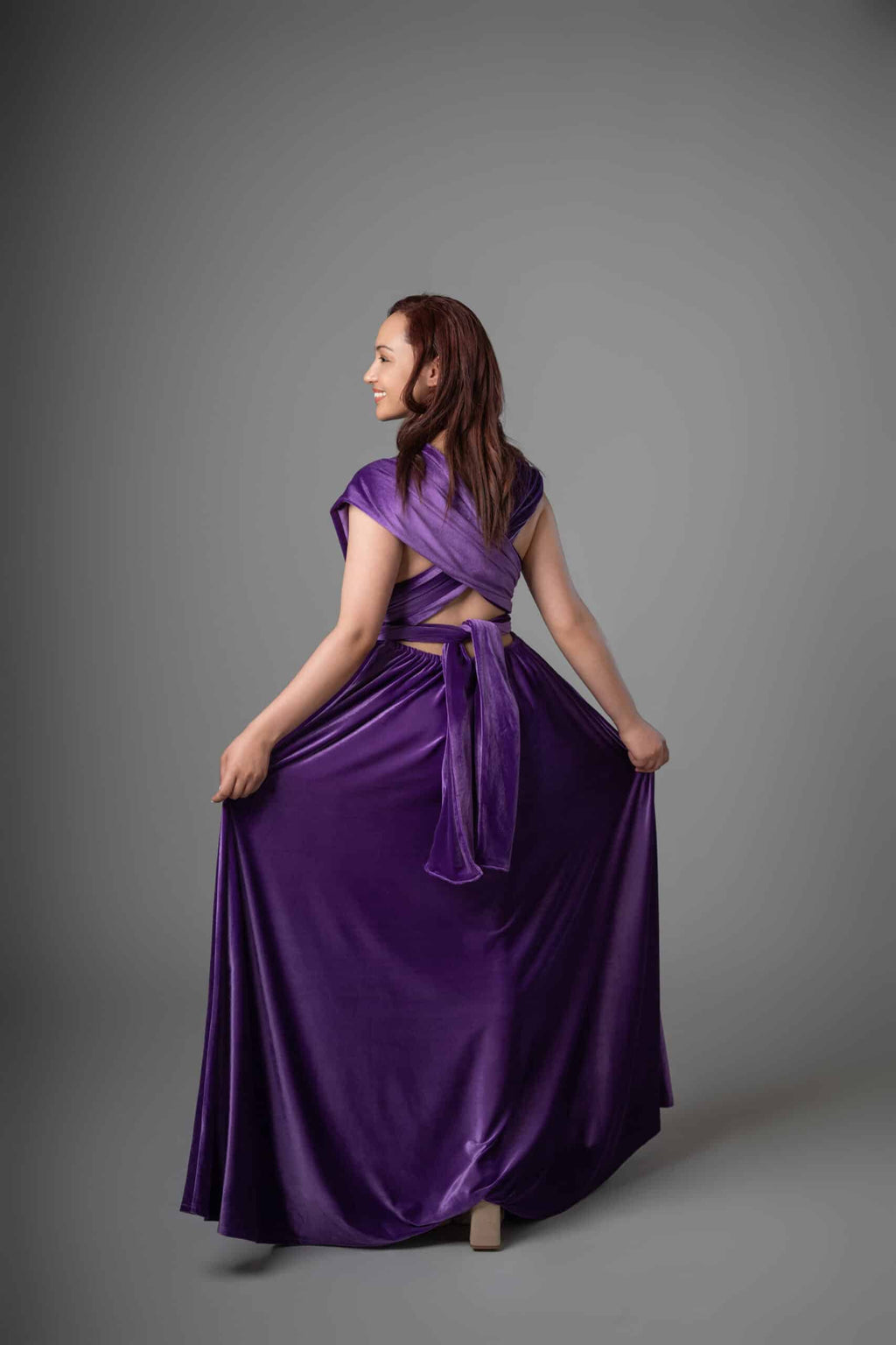 Back view of purple Infinity Dress showing wrapped back design and open-back detail