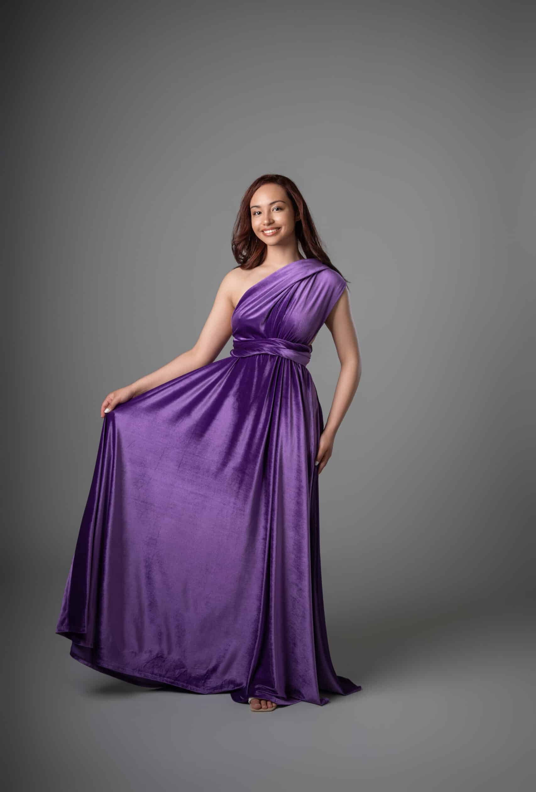 Infinity Dress in violet, asymmetrical design showing draped one-shoulder neckline and flowing hemline