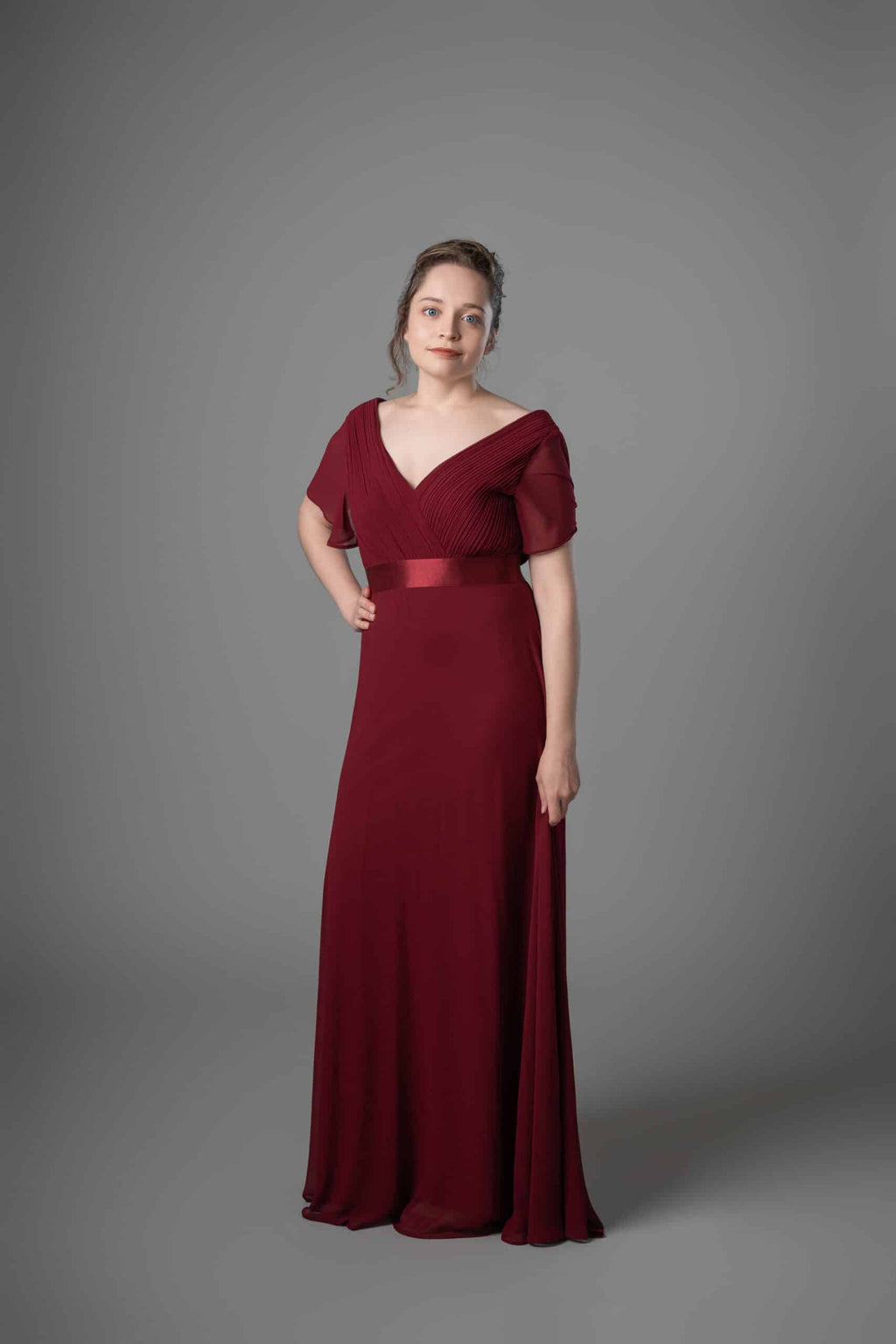 Burgundy chiffon bridesmaids dress with flutter sleeves and ruched bodice
