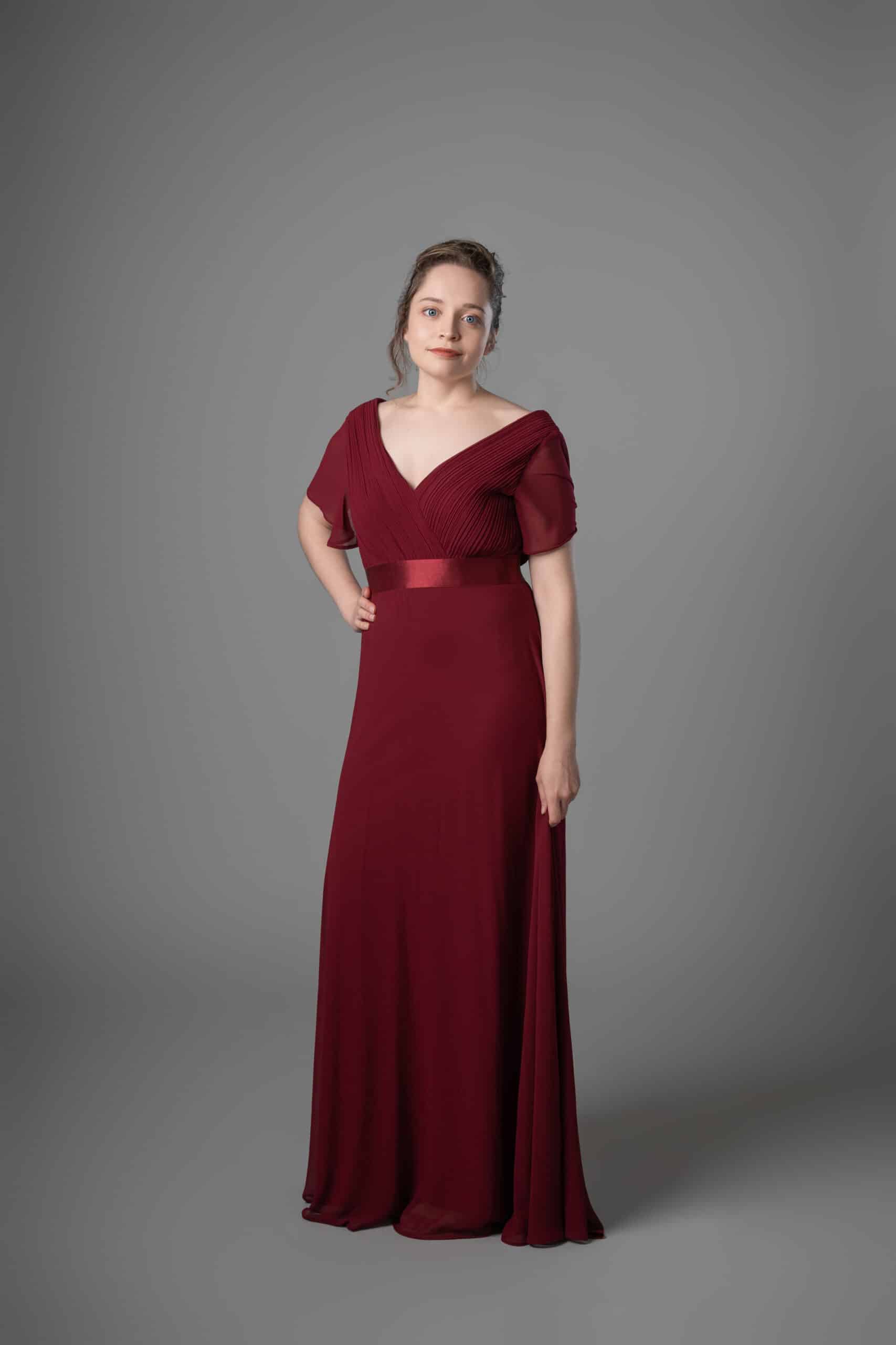 Burgundy chiffon bridesmaids dress with flutter sleeves and ruched bodice