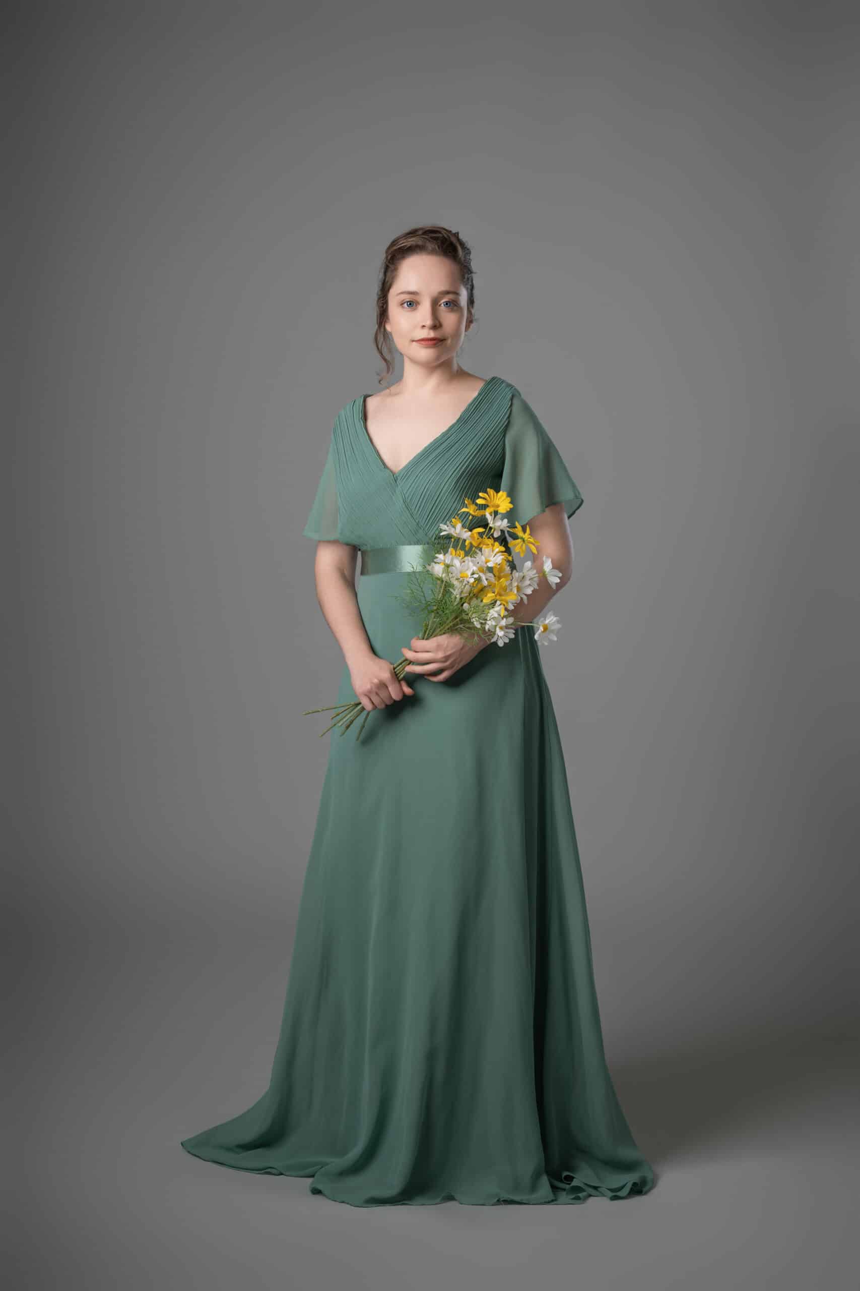 Sage green chiffon bridesmaids dress with flutter sleeves and flowing skirt