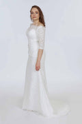 Ivory guipure lace three-quarter sleeve wedding dress with fitted bodice and flowing train – Art Kollocsion
