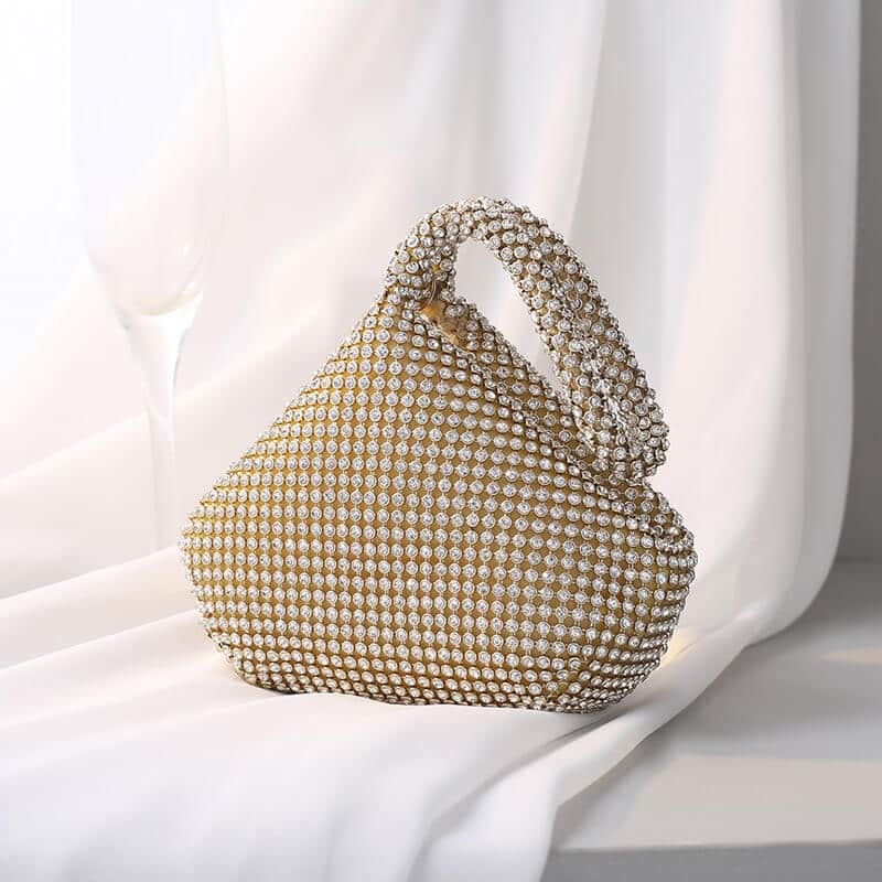 Gold-tone rhinestone evening bag with beaded handle and rounded frame silhouette