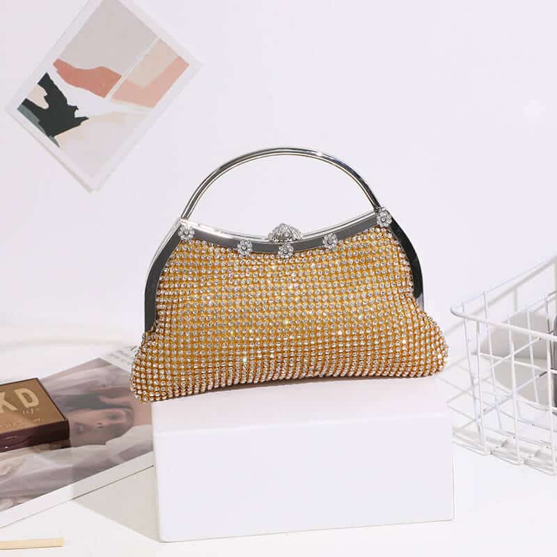Gold rhinestone clutch bag with silver frame and curved top handle, front view – Art Kollocsion Auckland