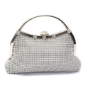 Silver crystal-covered clutch bag with rhinestone floral details and curved handle, full front view