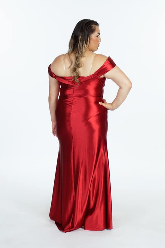 Back view of red off-shoulder dress showing draped back neckline detail