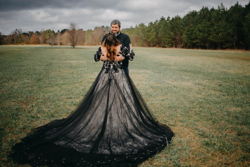 Model wearing black Gothic wedding dress with beaded floral bodice and dramatic tulle train – Art Kollocsion