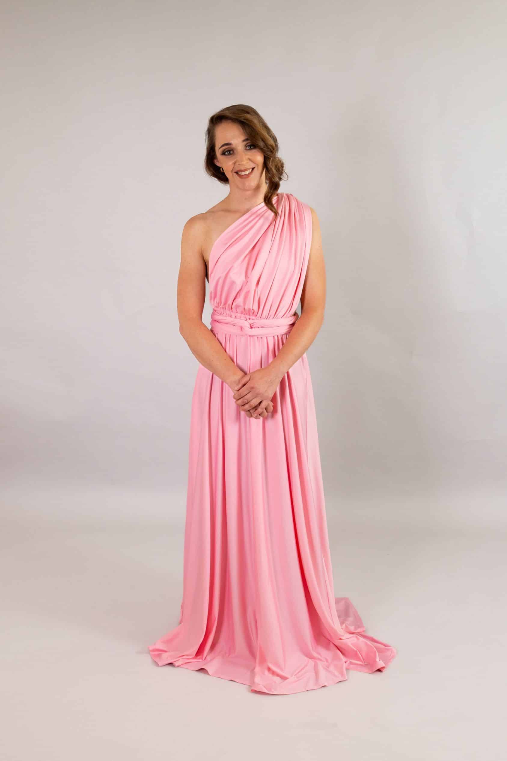 Baby pink multiway dress draped one-shoulder Grecian style with gathered waist and soft train